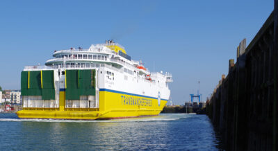 A ferry entering Newhaven Port, with the linkspan ahead on the right.